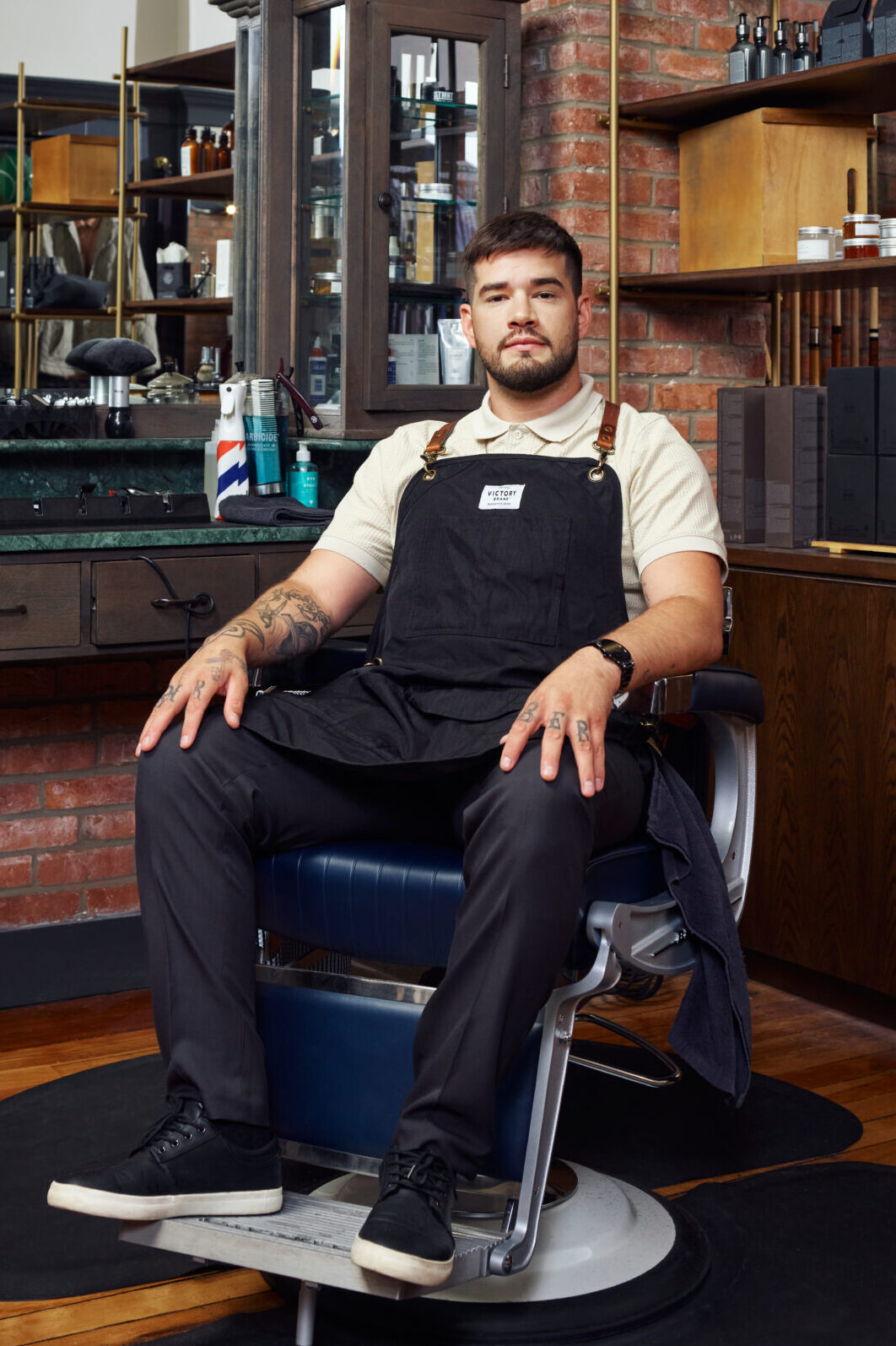 man sitting in barber chair