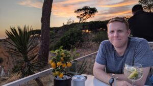 man sitting at dinner table in portugal 